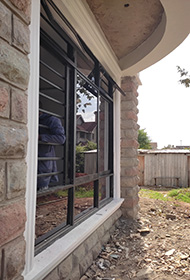Sample black aluminium sliding window with top and bottom fixed glass partitions